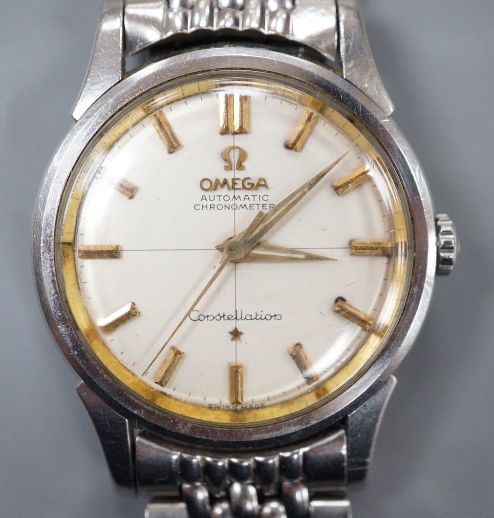 A gentleman's early 1960's stainless steel Omega Constellation automatic chronometer wrist watch, on steel Omega bracelet, movement c.551, case diameter 35mm.